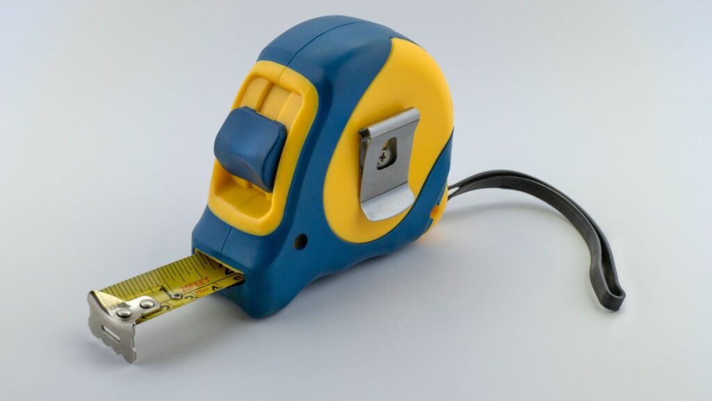 home renovation planning with floor plans and measuring tools